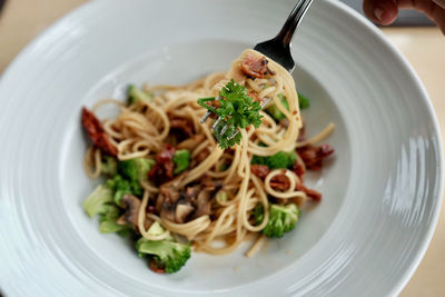 Close-up of noodles served in plate on table