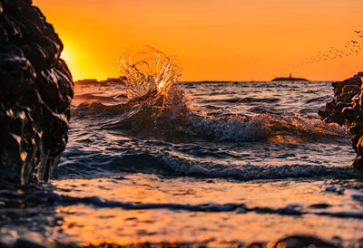 Scenic view of sea against sky during sunset