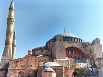 Low angle view of mosque against sky