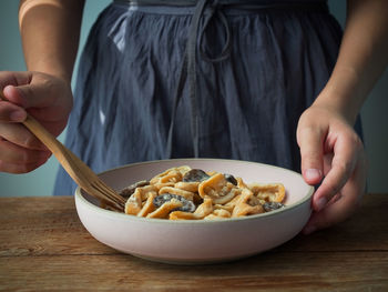 Midsection of woman having food