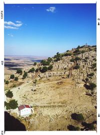 Scenic view of rock formation against blue sky