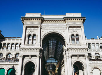 Low angle view of historical building against blue sky