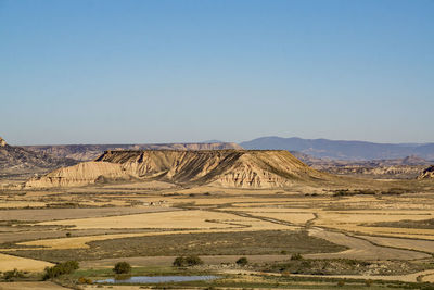Scenic view of desert against clear sky