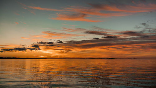 Scenic view of sea against orange sky