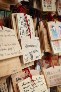 Close-up of love padlocks hanging on paper