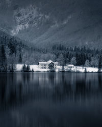 Scenic view of lake against sky during winter