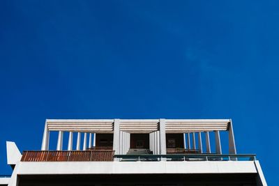 Low angle view of building against blue sky