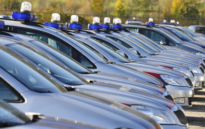 Close-up of cars in parking lot