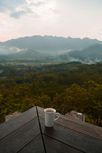 High angle view of coffee on landscape against sky
