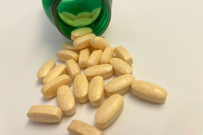 Close-up of pills on white background