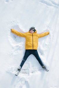 Man with umbrella on snowy field