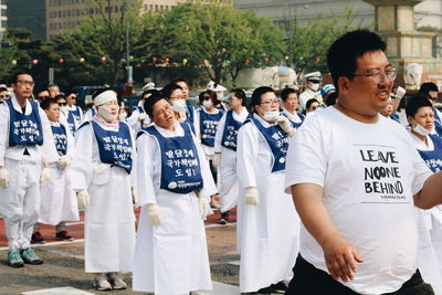 People standing on street in city