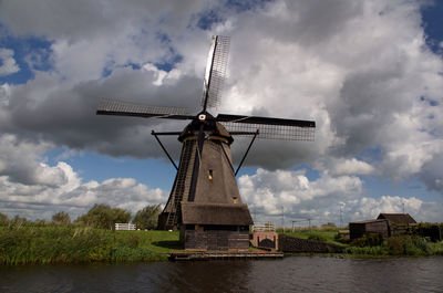 Traditional windmill against sky