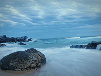 Scenic view of sea against cloudy sky