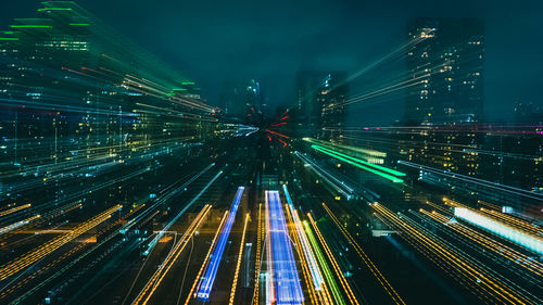 Light trails on illuminated city at night