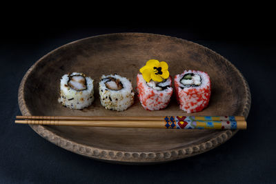 High angle view of sushi on table against black background