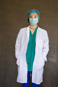 Woman doctors portrait, doctors with mask, glasses, glove and uniform. uniform for surgery 