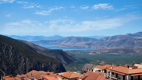 Scenic view of mountains with houses in foreground