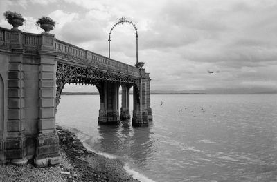 Bridge over sea against sky