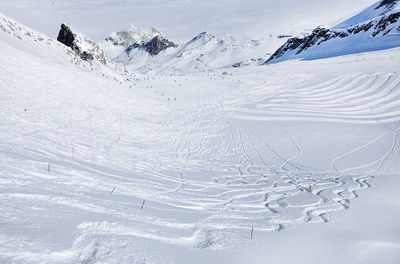 Ski tracks on the slope in a ski resort