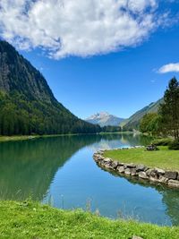 Scenic view of lake and mountains against sky