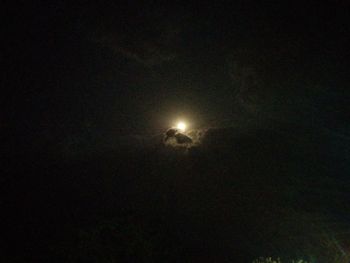 Low angle view of moon against sky at night