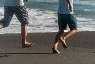 Low section of people on beach