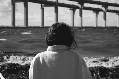 Rear view of woman looking at sea