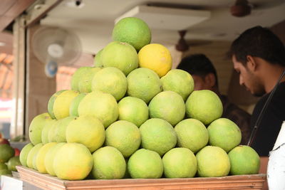 Stack of key limes for sale at shop