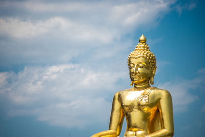 Low angle view of statue against sky