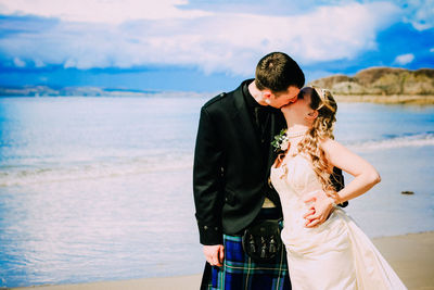 High angle view of woman standing on beach