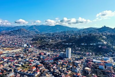 High angle view of city against cloudy sky