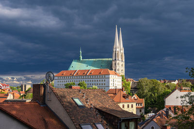 Buildings in city against sky