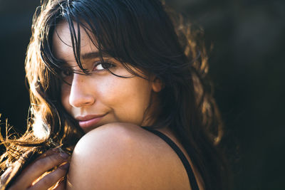 Young latina woman portrait at golden hour in summertime