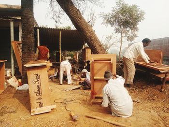 People working at market stall