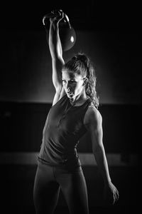 Young woman exercising at gym