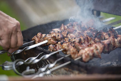 Close-up of meat on barbecue grill