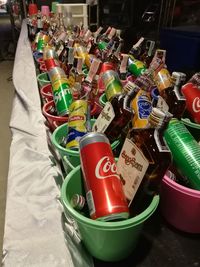 High angle view of multi colored bottles on shelf