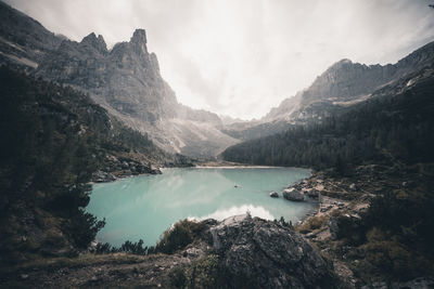 Scenic view of lake and mountains against sky