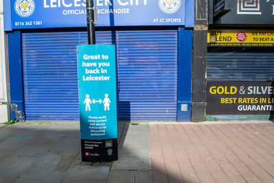 Information sign on footpath in city