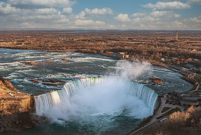 Aerial view of waterfall against sky