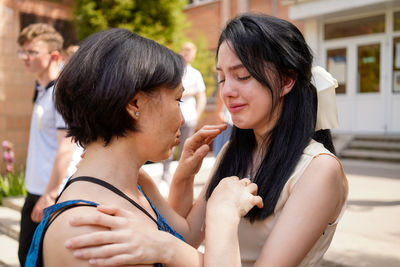 Side view of two women