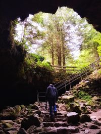 Full length of woman standing on rock