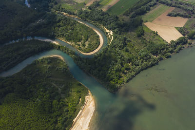 High angle view of road amidst trees on landscape