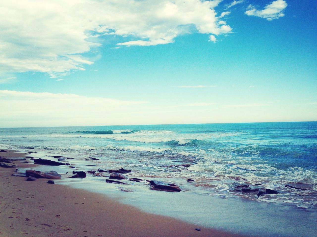 sea, beach, water, horizon over water, sky, shore, sand, tranquility, scenics, tranquil scene, beauty in nature, nature, blue, cloud - sky, coastline, idyllic, cloud, wave, day, outdoors