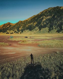 Scenic view of landscape and mountains against sky