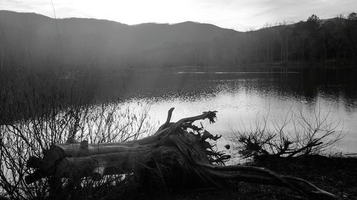 Scenic view of lake against sky during sunset