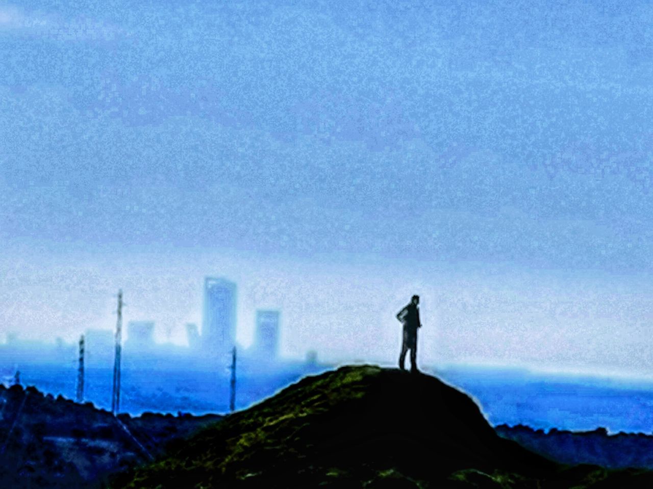 sky, horizon, mountain, one person, silhouette, nature, standing, leisure activity, scenics - nature, cloud, landscape, beauty in nature, tower, full length, men, environment, blue, outdoors, adult, architecture, morning, lifestyles, day, built structure, land, building exterior, activity, sea, wind, tranquility, copy space, rear view