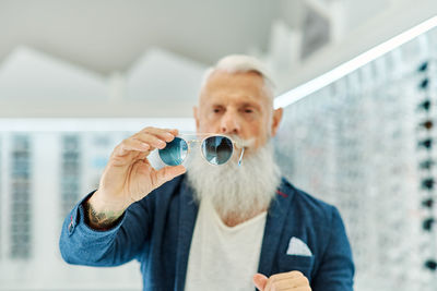 Portrait of man drinking water