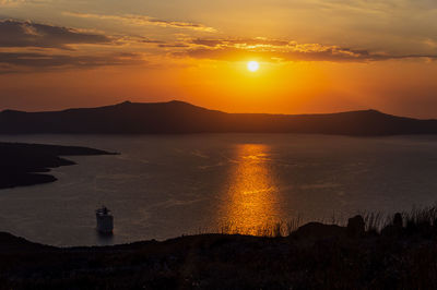 Evening view of caldera, volcano of santorini, greece with cruise ships at sunset. 